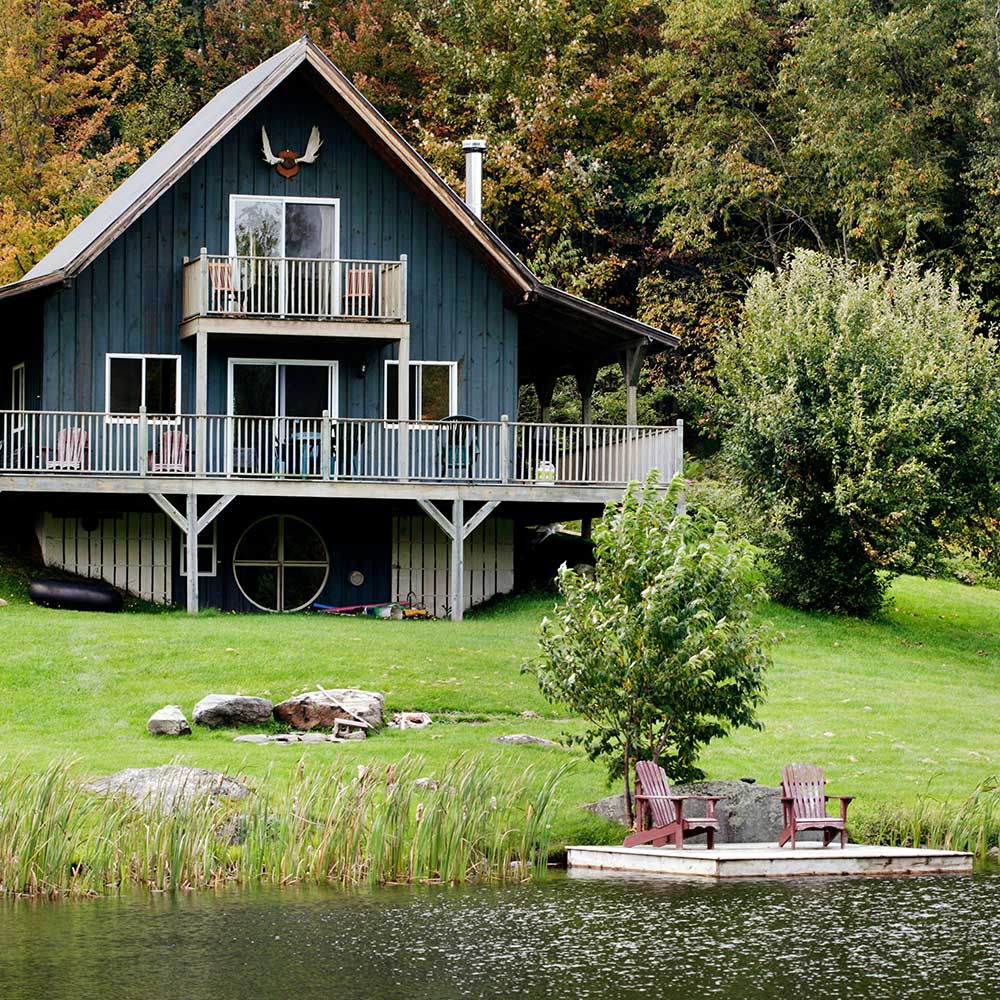 Cabin by a lake close to forest